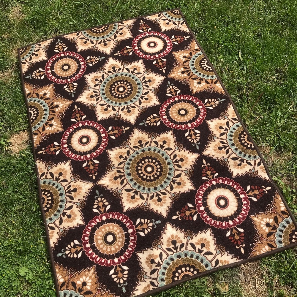 SOLD 40" by 60" patterned rug. Never been used.